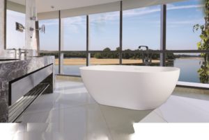 Luxury bathroom with stand alone tub near windows in a skyscraper